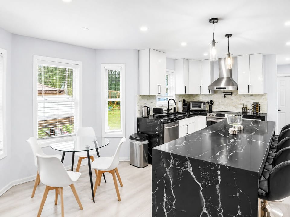 Bright open kitchen made for cooking, snacking, and lingering together.