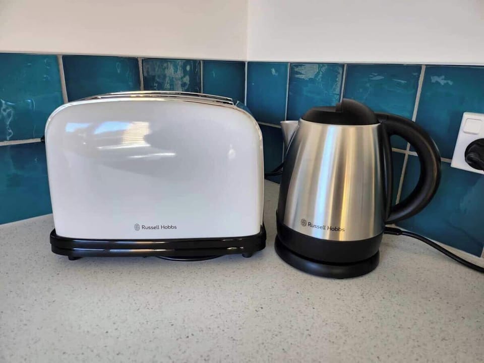 A toaster and kettle to make breakfast and a cup of tea.
