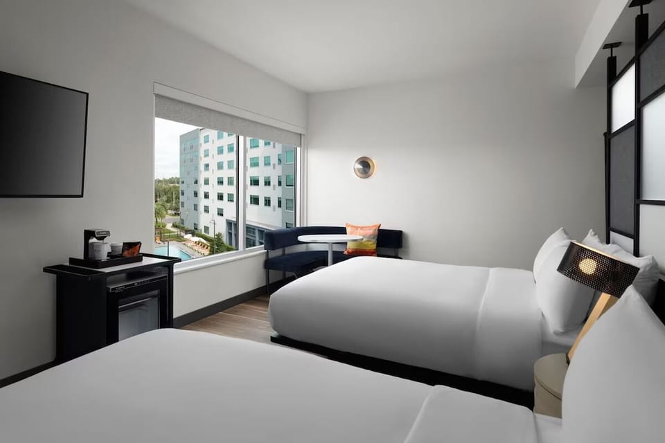 Settle in together with two plush beds and a bright view.