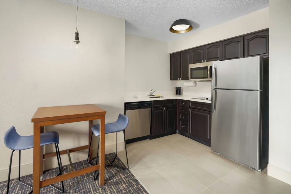 Cook easy meals in the sleek kitchenette with full-size fridge.