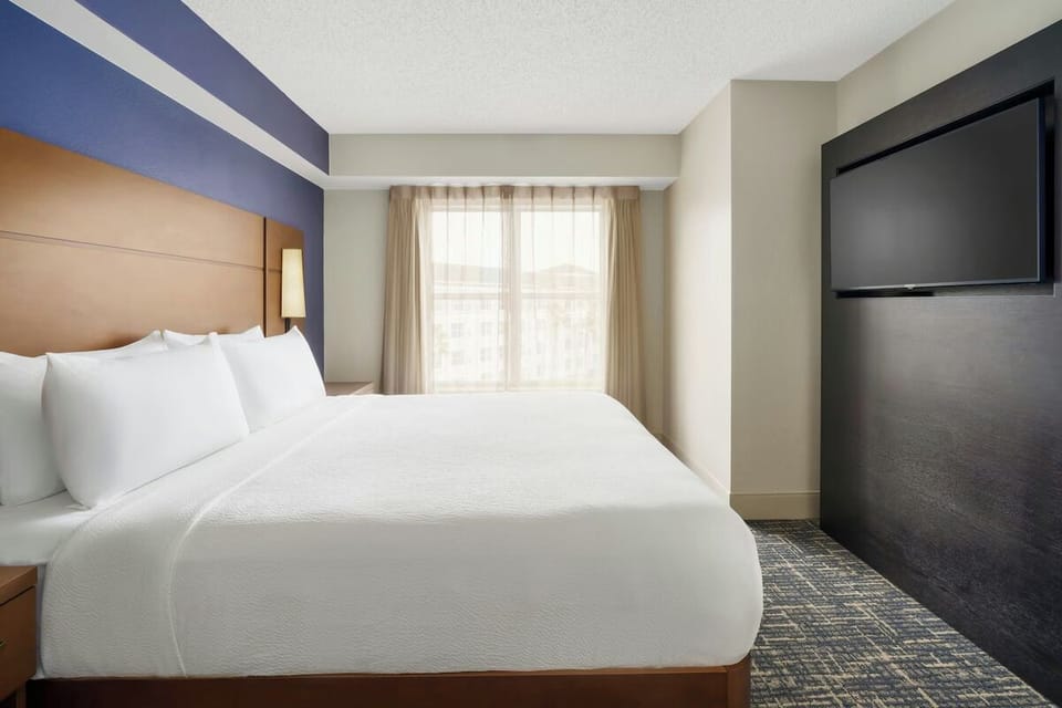 Sink into plush white bedding and wake to gentle light.