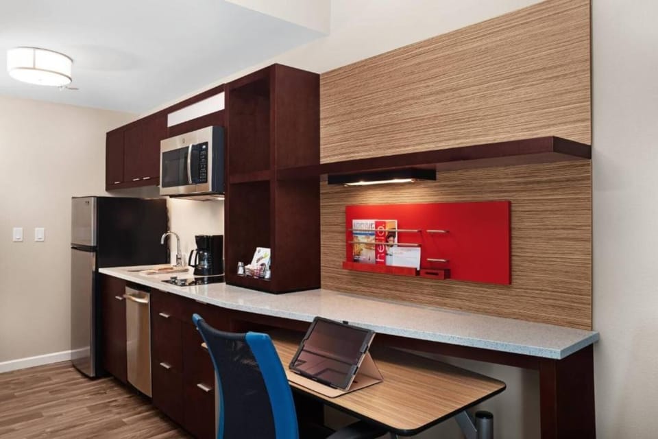 Settle in at the work desk beside the kitchenette.