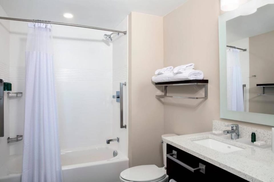 Refresh after a long day in the bright, spotless bath.