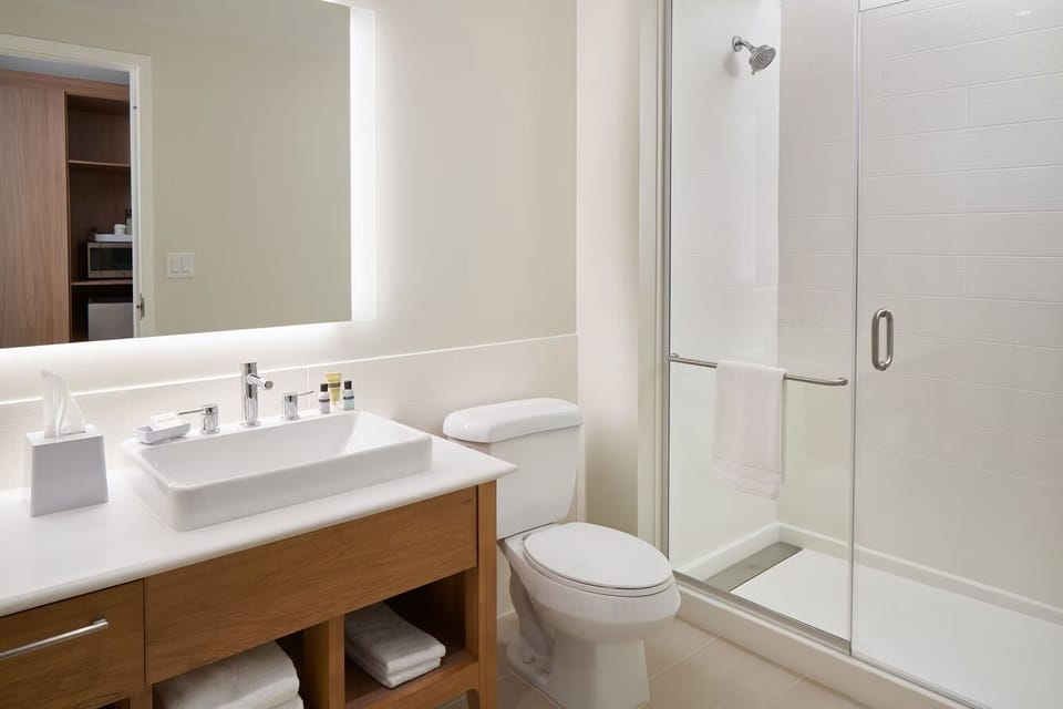 Start your day at a bright vanity with plush towels.