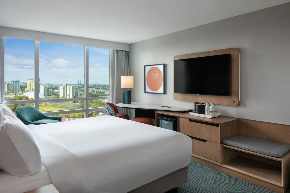 Wake up to bright skyline views from your cozy room.