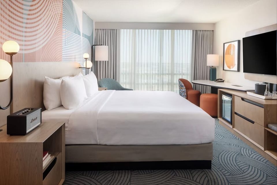 Unwind in a plush king bed with modern comforts.