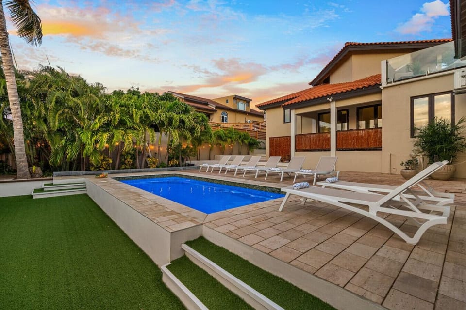 Open pool area with loungers for laid back Aruba days