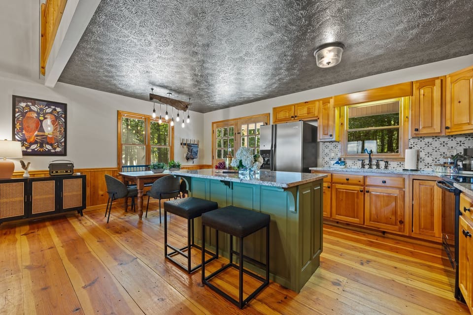 The fully-stocked kitchen connects to both the dining room and living room so no one is stuck in the kitchen during dinner prep. 