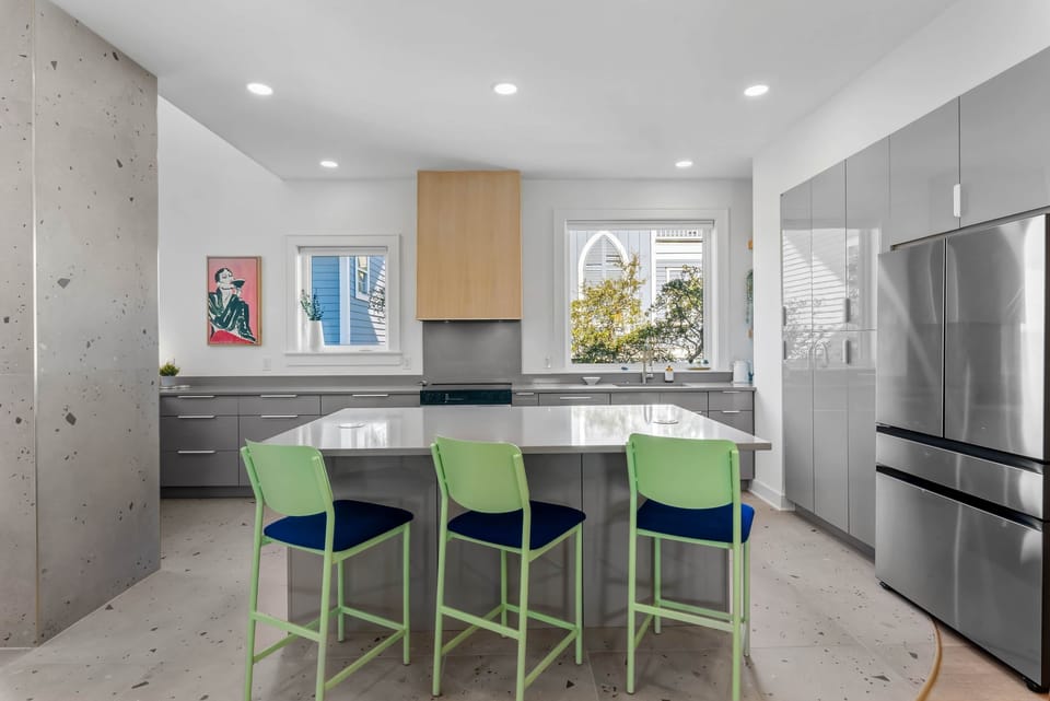 Modern kitchen with large island and bar seating, perfect for casual dining