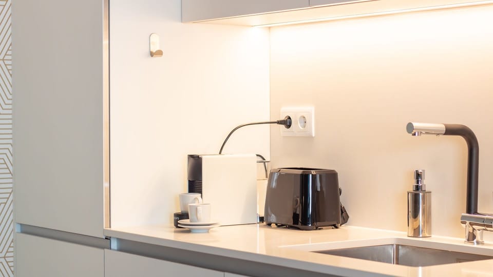 Coffee machine, toaster and more — feel right at home.
#KitchenDetails #HomeAwayFromHome #PortoApartment