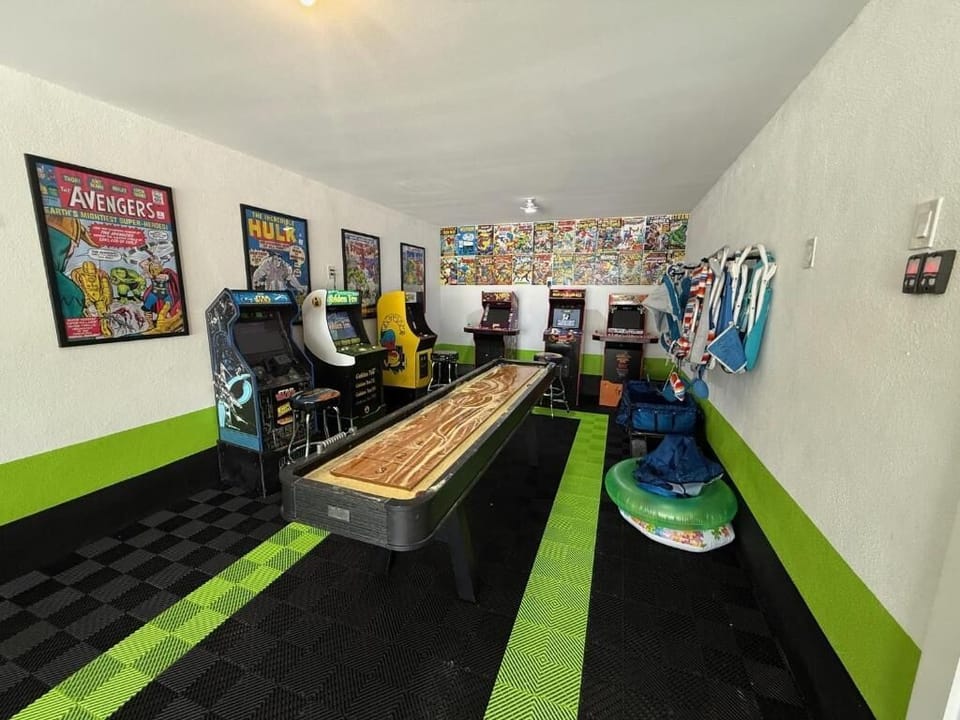 Your personal arcade awaits with classic games, shuffleboard, and comic book art creating the ultimate entertainment retreat.