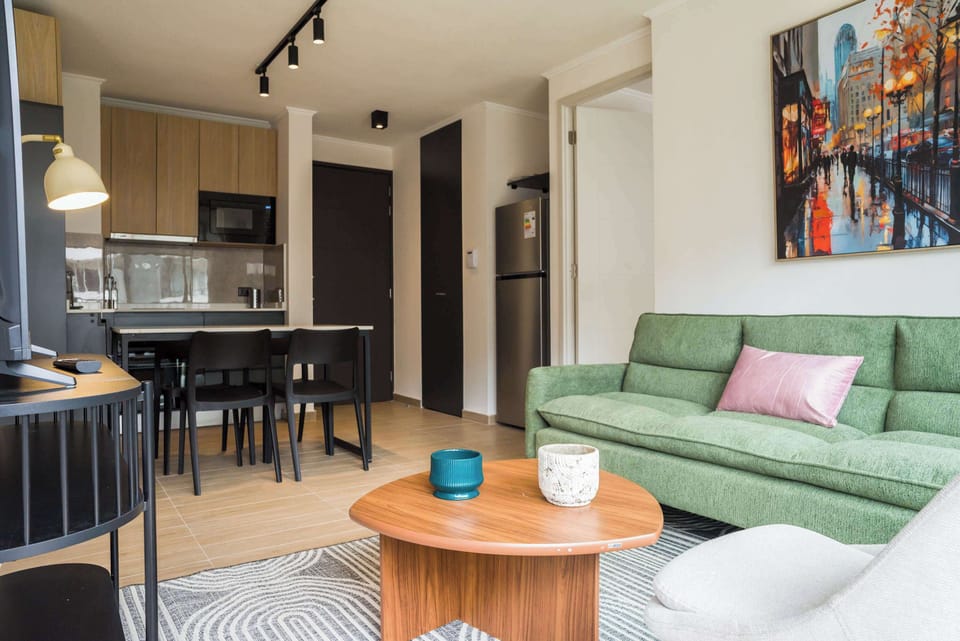 Cozy living area with modern amenities and a stylish kitchen, perfect for relaxation and dining.