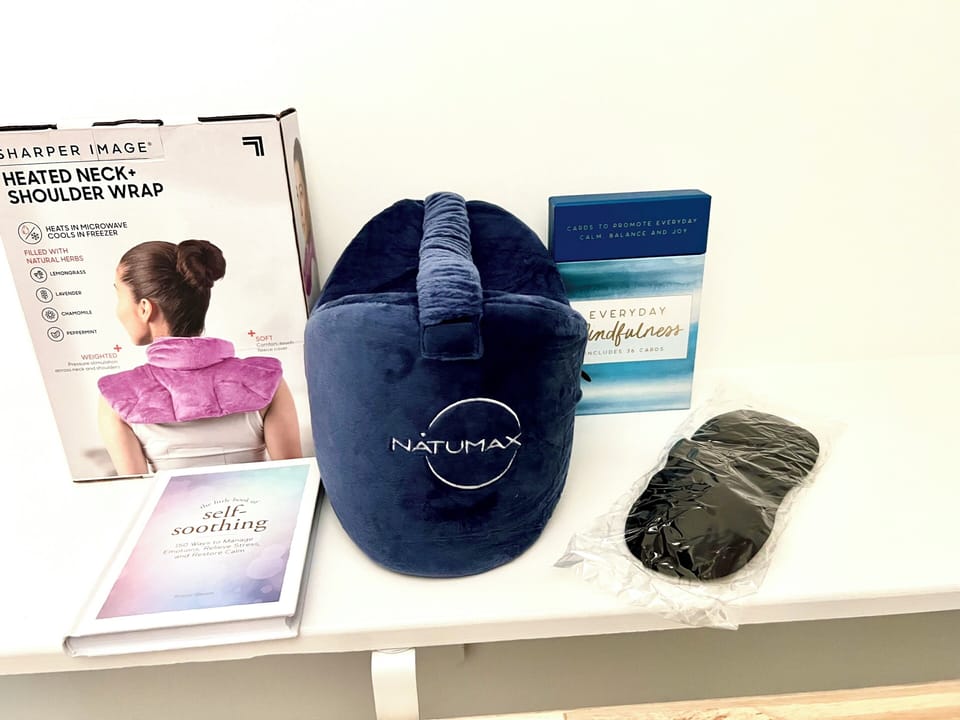 Wellness perks: heated neck wrap, sleep mask, and mindfulness cards