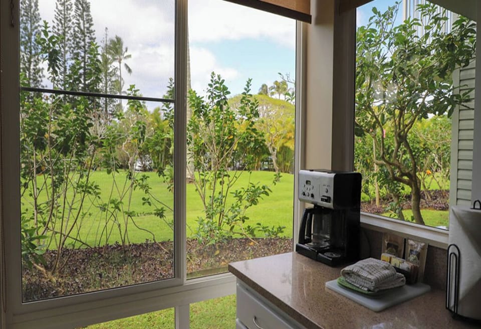 Wake up to coffee with lush garden views outside.