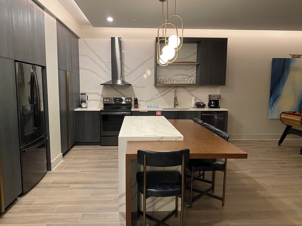 Presidential 1 bdrm Condo kitchen  stocked with cooking pots & serving utensils