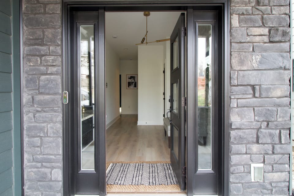 Welcoming front entry leading into the ground level of the home