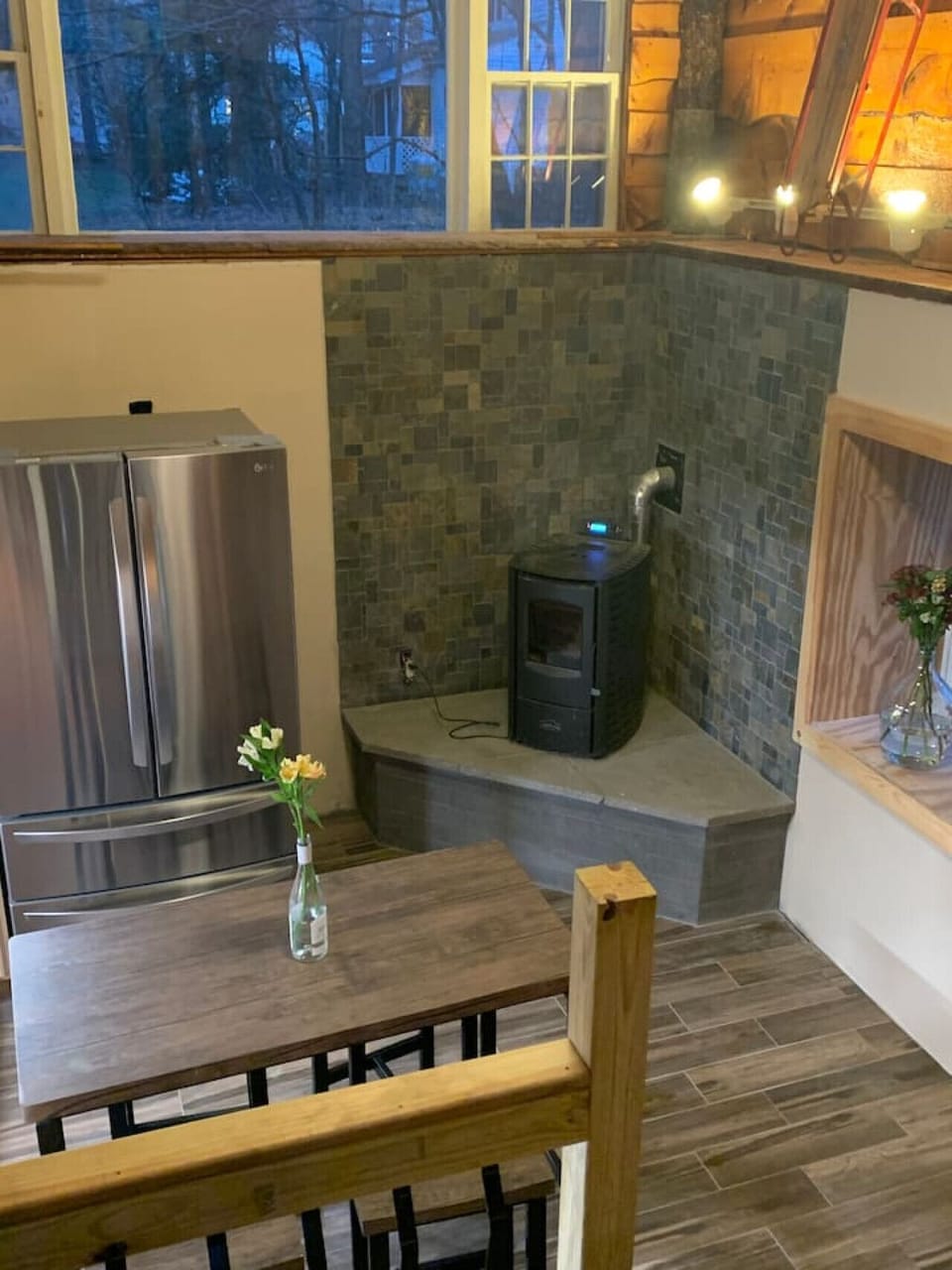 The main attraction of the kitchen is the pellet stove; easy to operate and gives off great heat.  The tile flooring is all radiant heat.  The dining table is light and can be moved to the desired area in the kitchen.