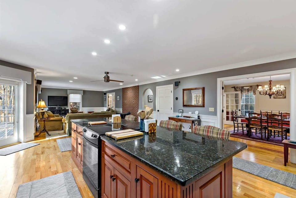 Kitchen sightlines to living and dining make hosting simple. Enjoy these comfortable gathering spaces for larger groups visiting Cape Cod.