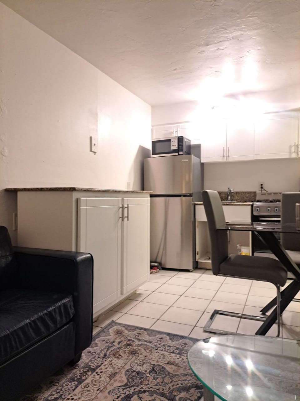 Kitchen with stainless steel appliances and granite prep area