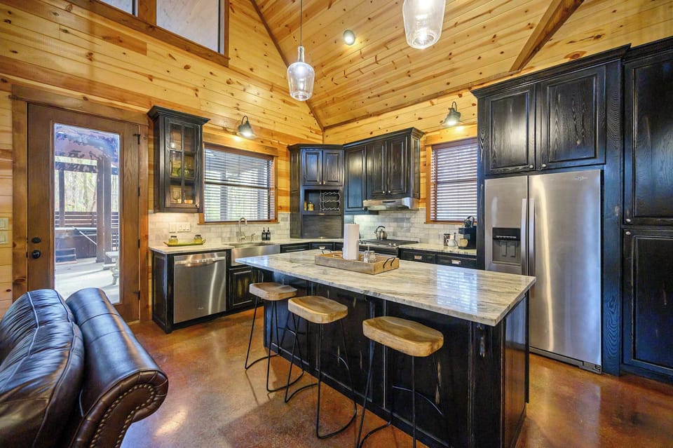 Modern rustic kitchen with island seating and stainless appliances