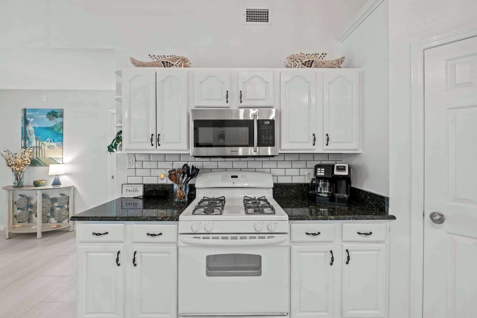 We've stocked this kitchen with full appliances, dishes, bake ware, pots & pans, silverware, utensils, crockpot, blender, and a traditional coffee maker & Keurig!