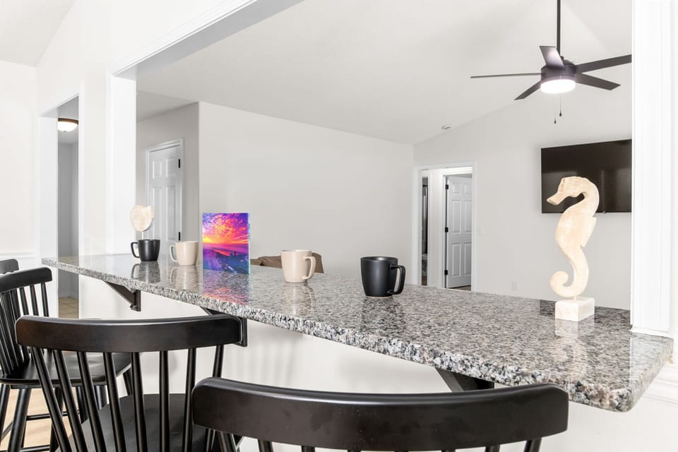 Granite Breakfast Bar with Seating | Coffee Station Ready for Your Mornings