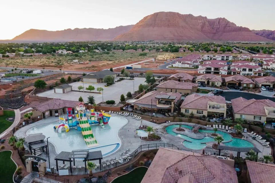 Kid pool area with slides, hot tub, snack shack, and lazy river