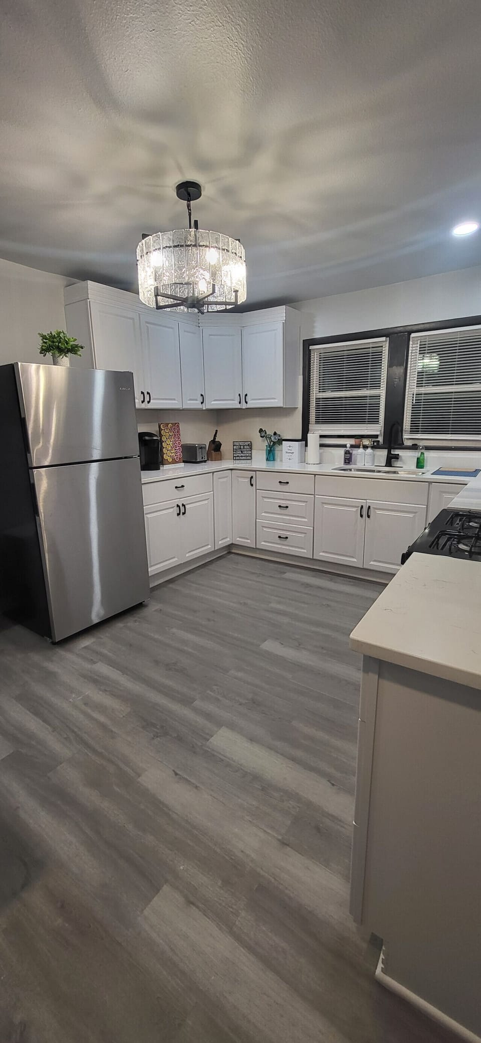 Our fully equipped, modern kitchen offers a spacious and functional layout with ample counter space and all the essential cookware needed to easily prepare home-cooked meals during your extended stay.