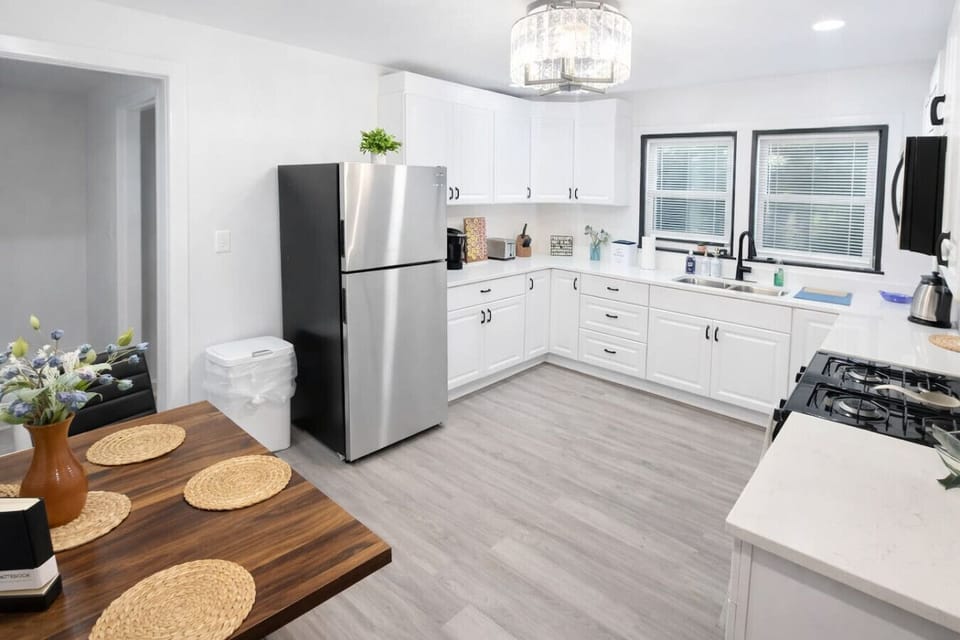 Our fully equipped, modern kitchen offers a spacious and functional layout with ample counter space and all the essential cookware needed to easily prepare home-cooked meals during your extended stay.