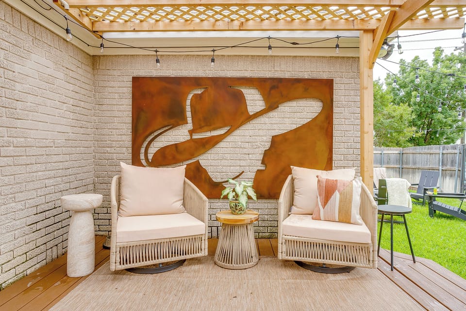 Cozy covered patio with stylish seating for morning coffee or wine 