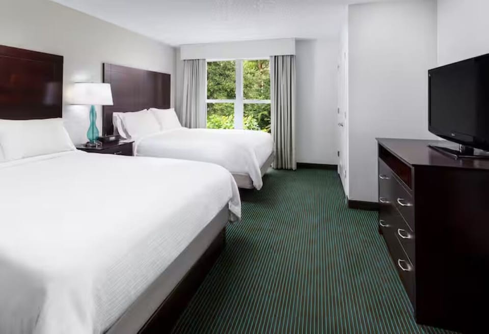 Sink into two plush beds after a day of exploring.