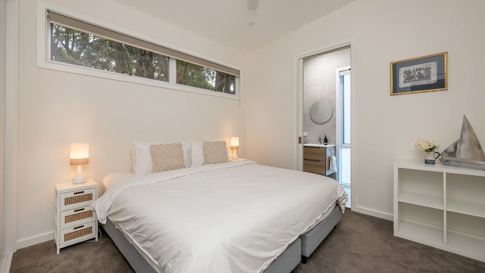 Bedroom three with king bed that can be spilt into two king single beds 