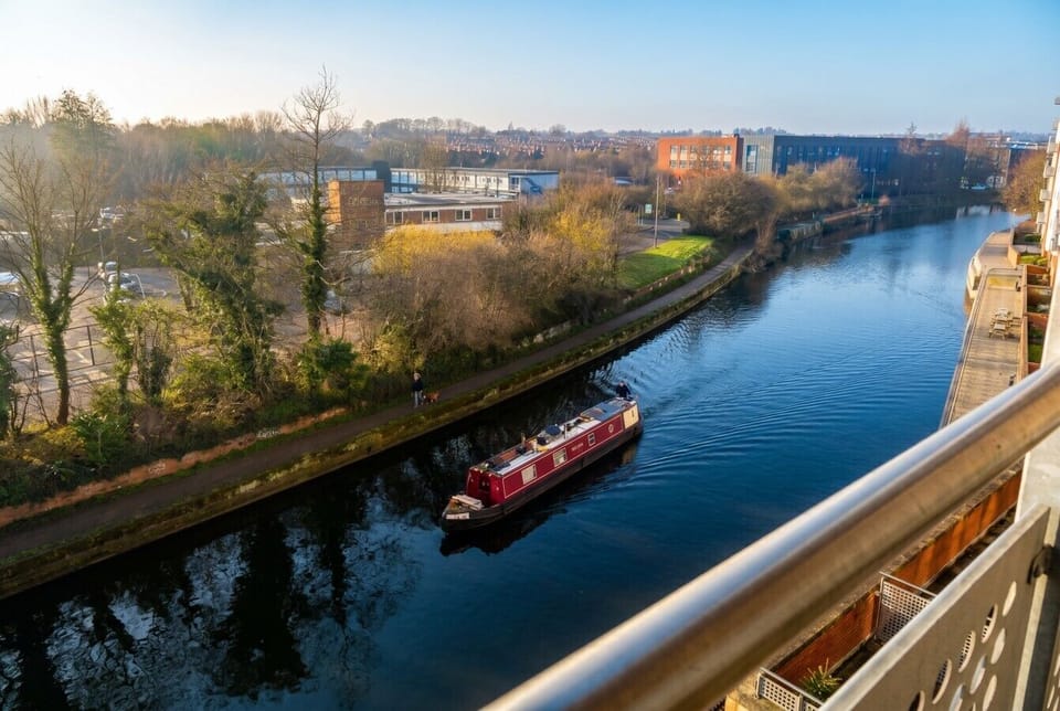 Watch narrowboats drift along the river from your private balcony.