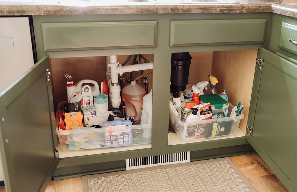 Under the sink stocked with lots of cleaning supplies to use during your stay, garbage bags, first aid kit, brand new song for every guest, dishwasher pods