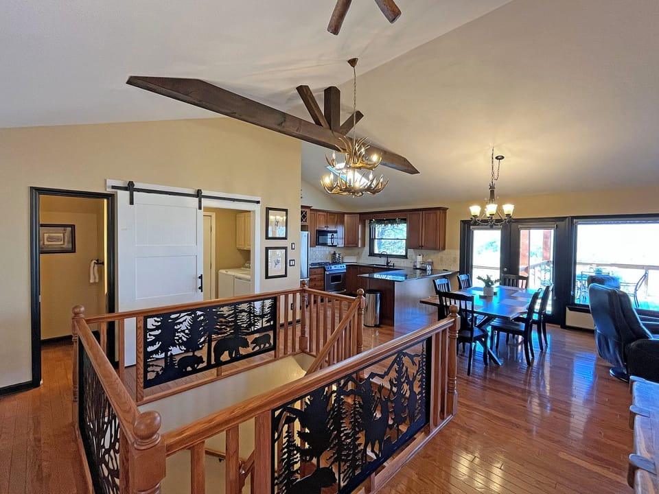 Stairs down to the 2nd Level where a second Family Room, King Bedroom with en-suite Bath, and Bunk Bed Room, and 3rd Level Game Room