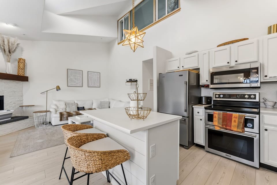 Step into your bright, open-concept sanctuary where modern kitchen meets cozy living space, complete with sleek appliances and stylish finishes for your perfect getaway.