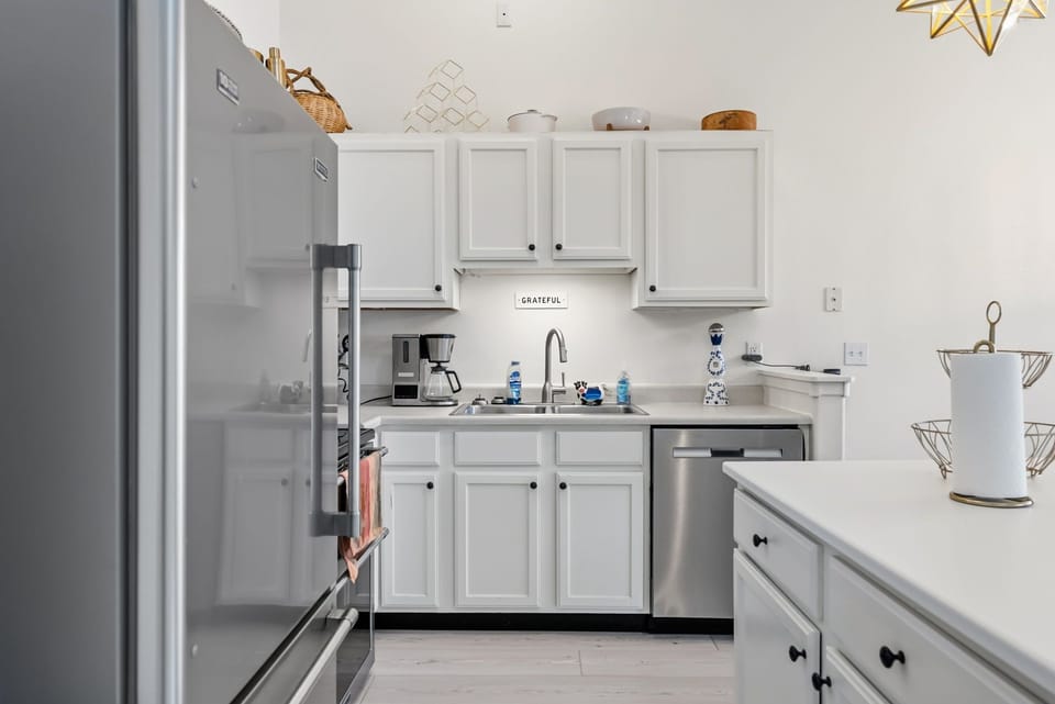 Your fully equipped kitchen features modern appliances and ample counter space, perfect for preparing meals during your stay.