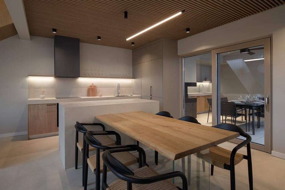 Fully equipped kitchen featuring top-of-the-line appliances and a spacious indoor dining area.