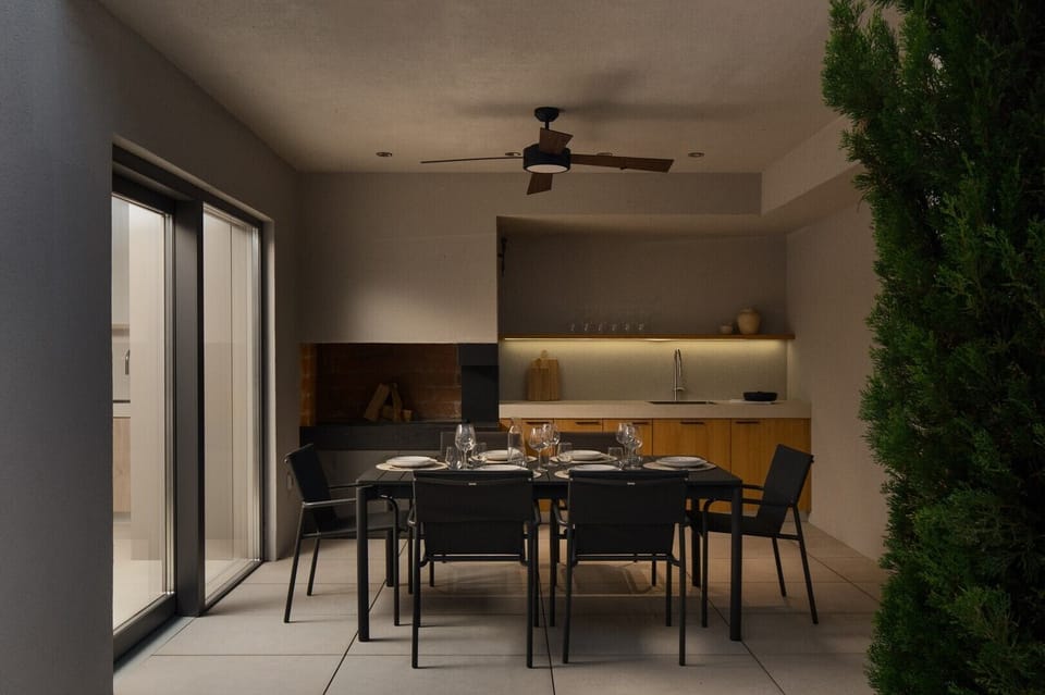 Covered terrace with a summer kitchen and dining area, perfect for group entertaining and al fresco meals.