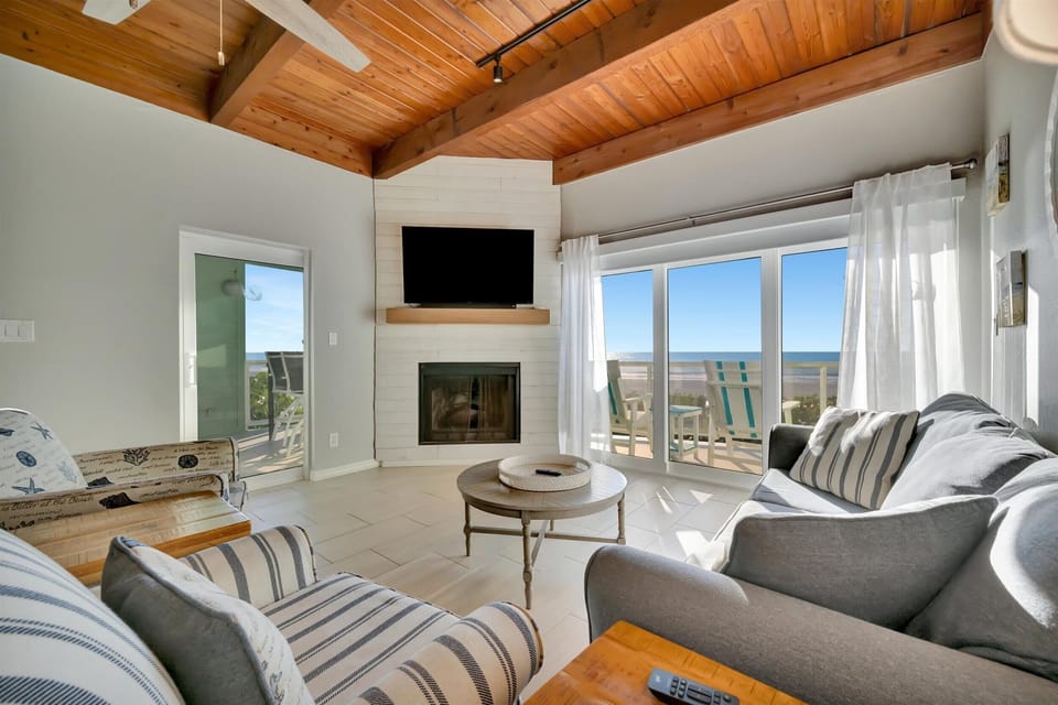 Bright living room with vaulted wood ceiling