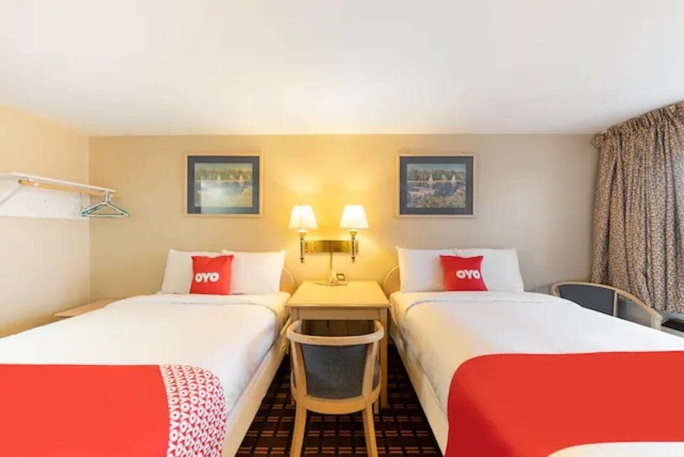 Unwind into crisp double beds with warm, calming lighting.