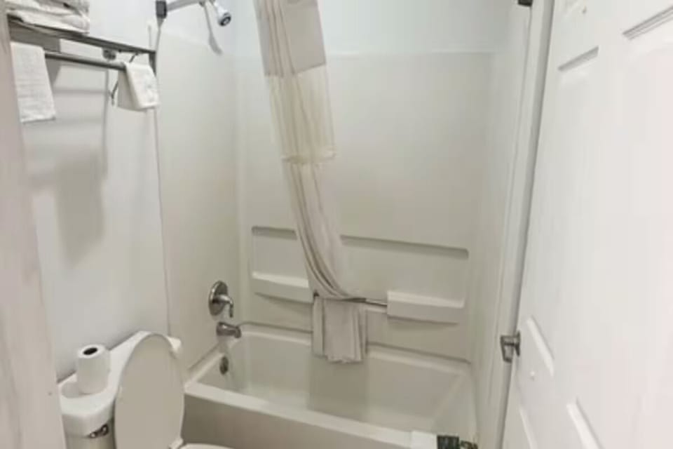 Refresh after exploring in a bright, spotless tub shower.