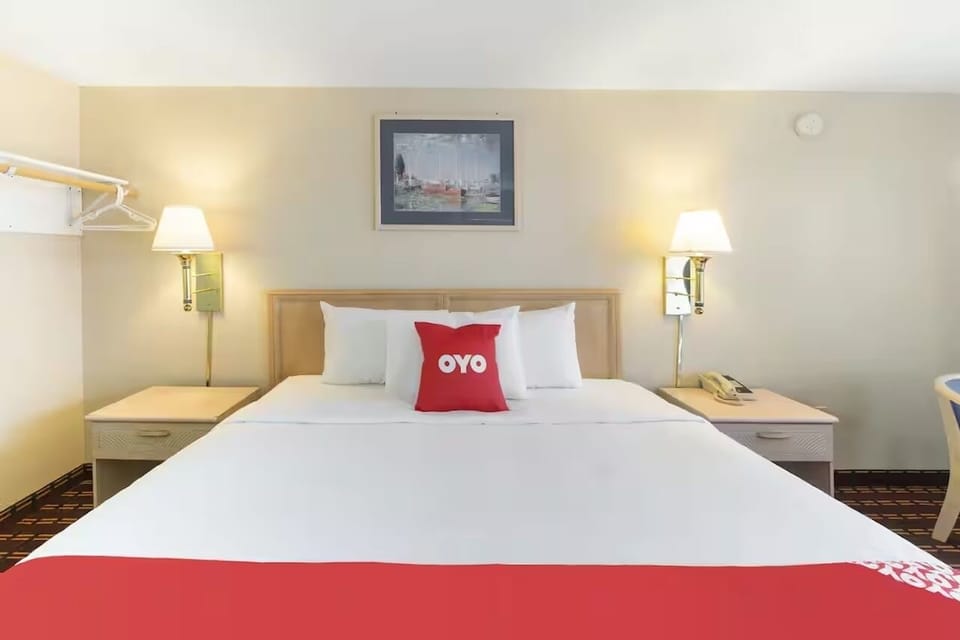 Sink into a plush king bed beneath soothing bedside lamps.