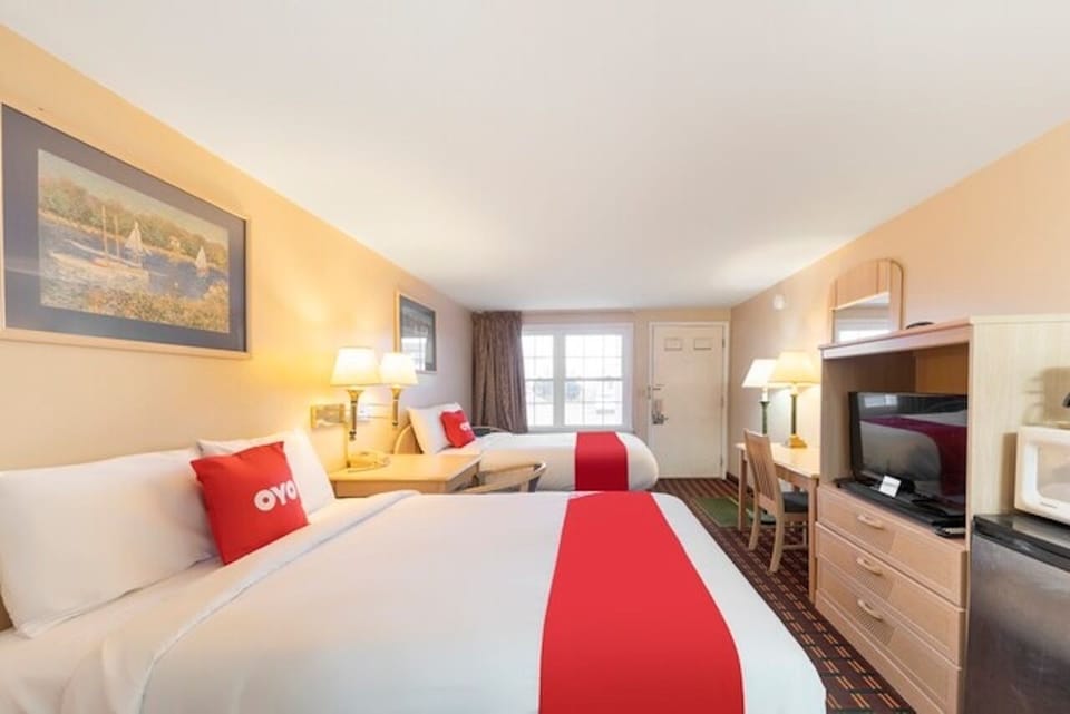 Unwind in crisp beds with bright light and cozy seating.