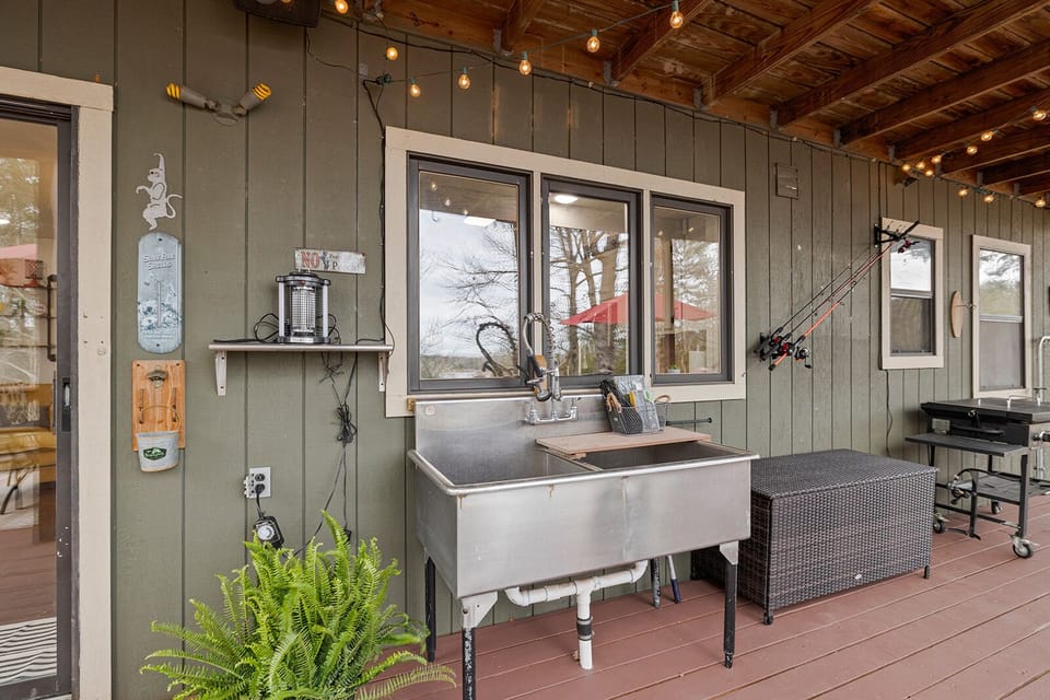 Fish cleaning station, fishing poles, and tackle.