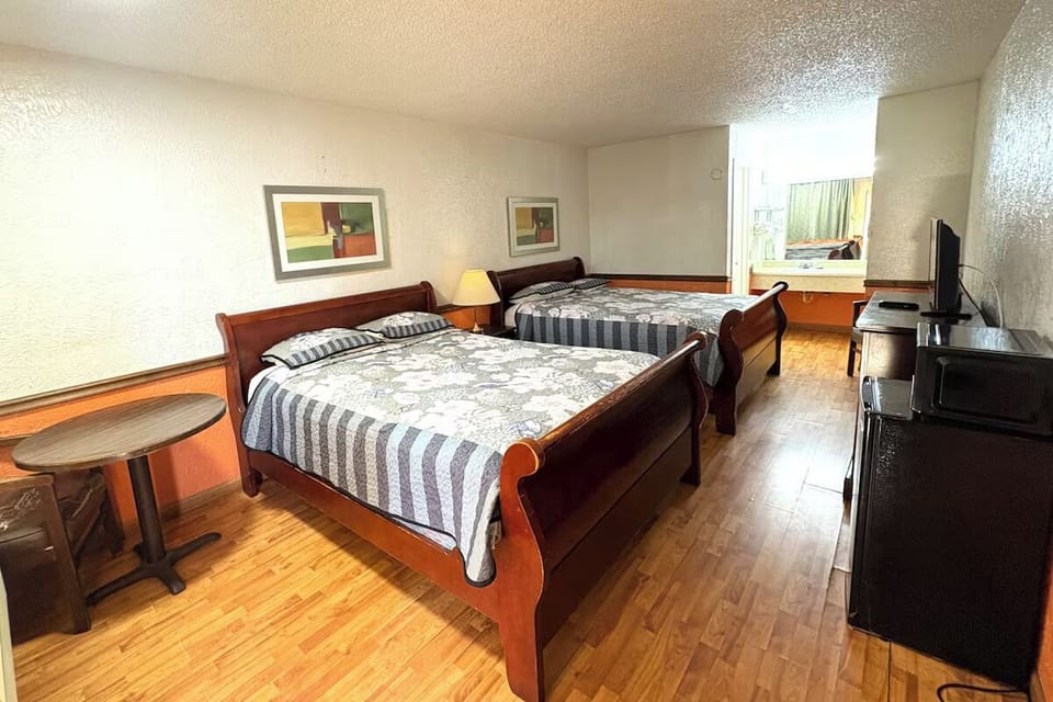 Wake up refreshed in a spacious room with two comfy beds.