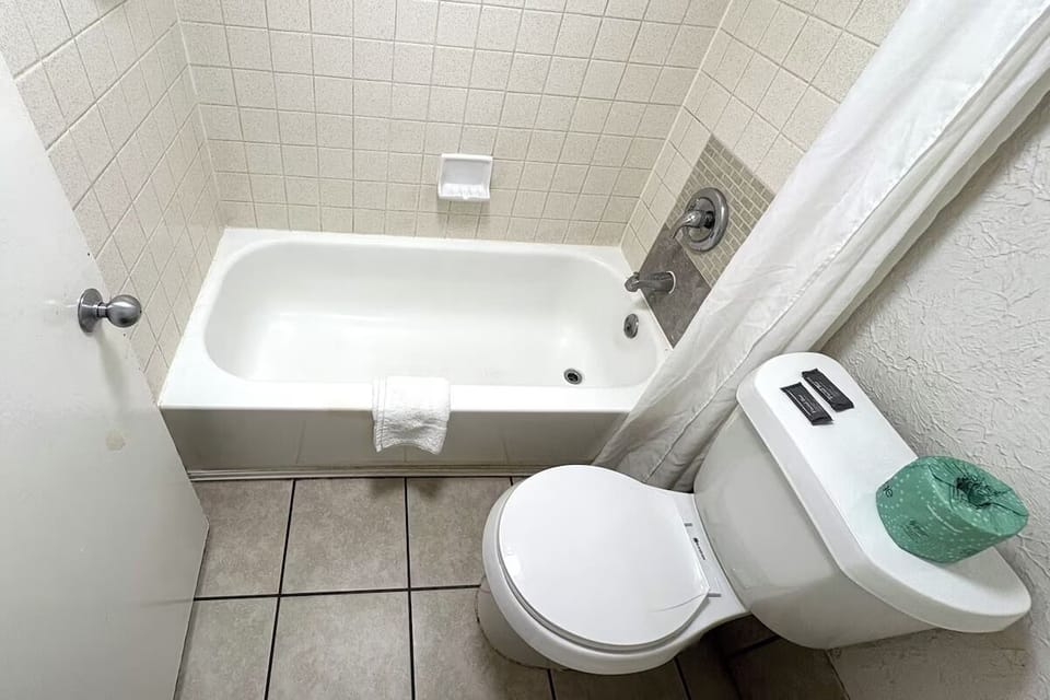 Rinse off with an easy tub-shower setup for comfort.