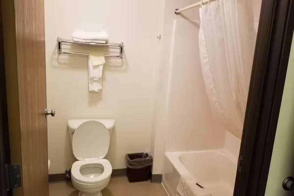 Rinse off in the clean tub-shower combo, simple and practical.