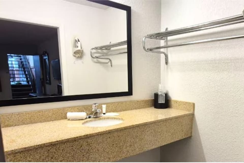 Refresh at the spacious vanity with bright, easy morning light.