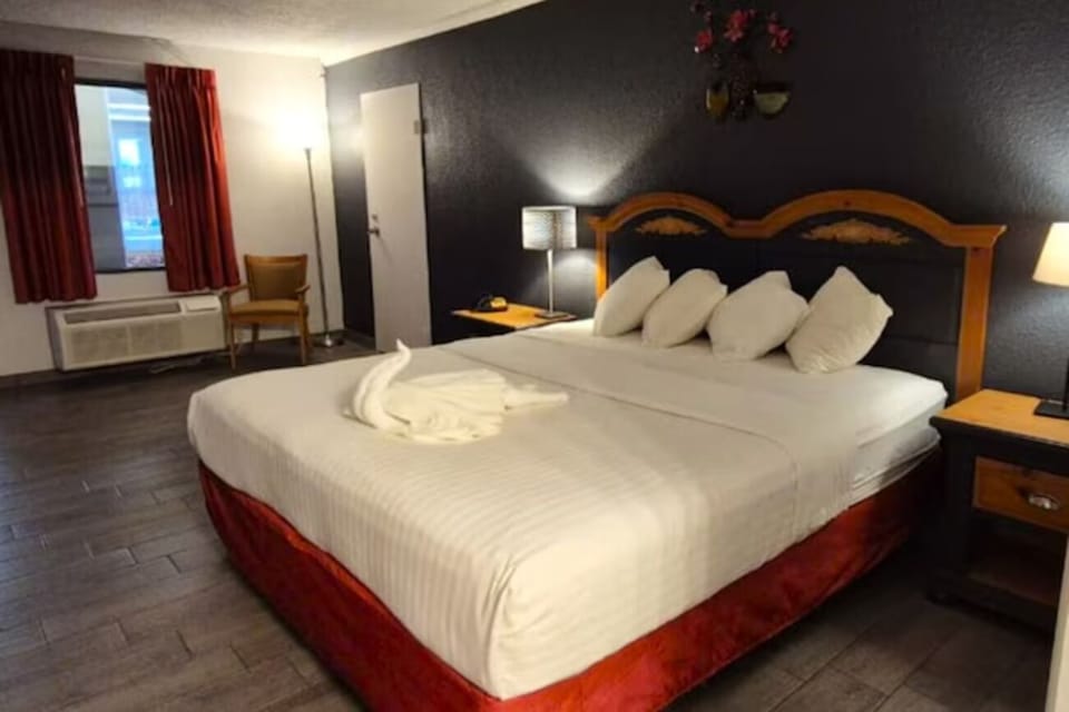 Unwind into crisp linens for a restful night’s sleep.